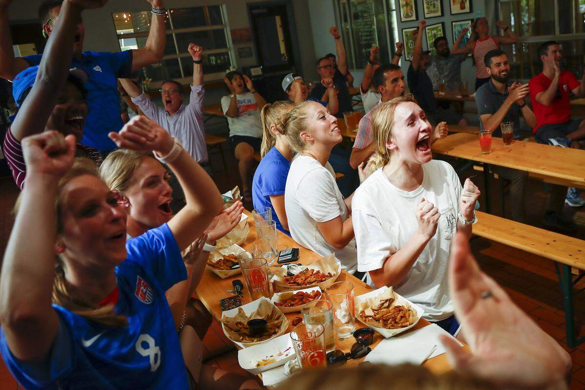 Laura Westneat, of Lexington, Ky., center, and Kelsie Steber, of Danville, Ky., right, celebrate after United States goalkeeper Alyssa Naeher saves a penalty shot taken by England’s Steph Houghton during a Women’s World Cup semifinal soccer match watch party at West Sixth Brewing in Lexington, Ky., Tuesday, July 2, 2019. The United States beat England 2-1.