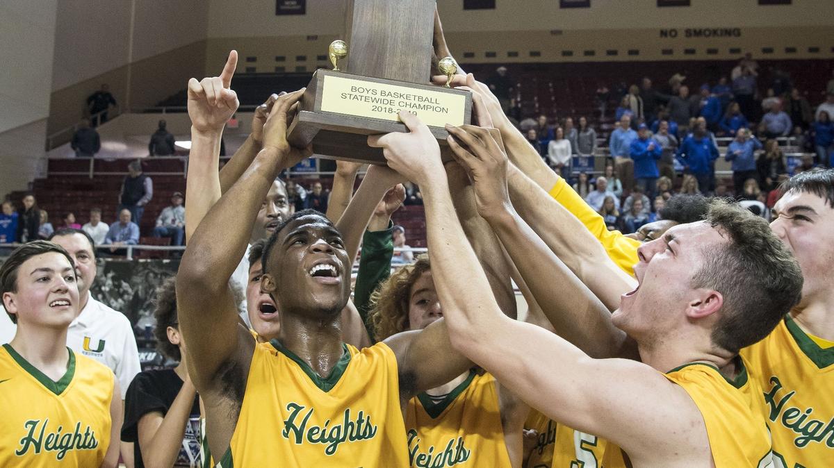 University Heights Academy celebrates with the championship trophy after beating LCA 52-40, in the finals of the boys All-A Classic, Sunday, January 27, 2019, at EKU’s McBrayer Arena in Richmond.