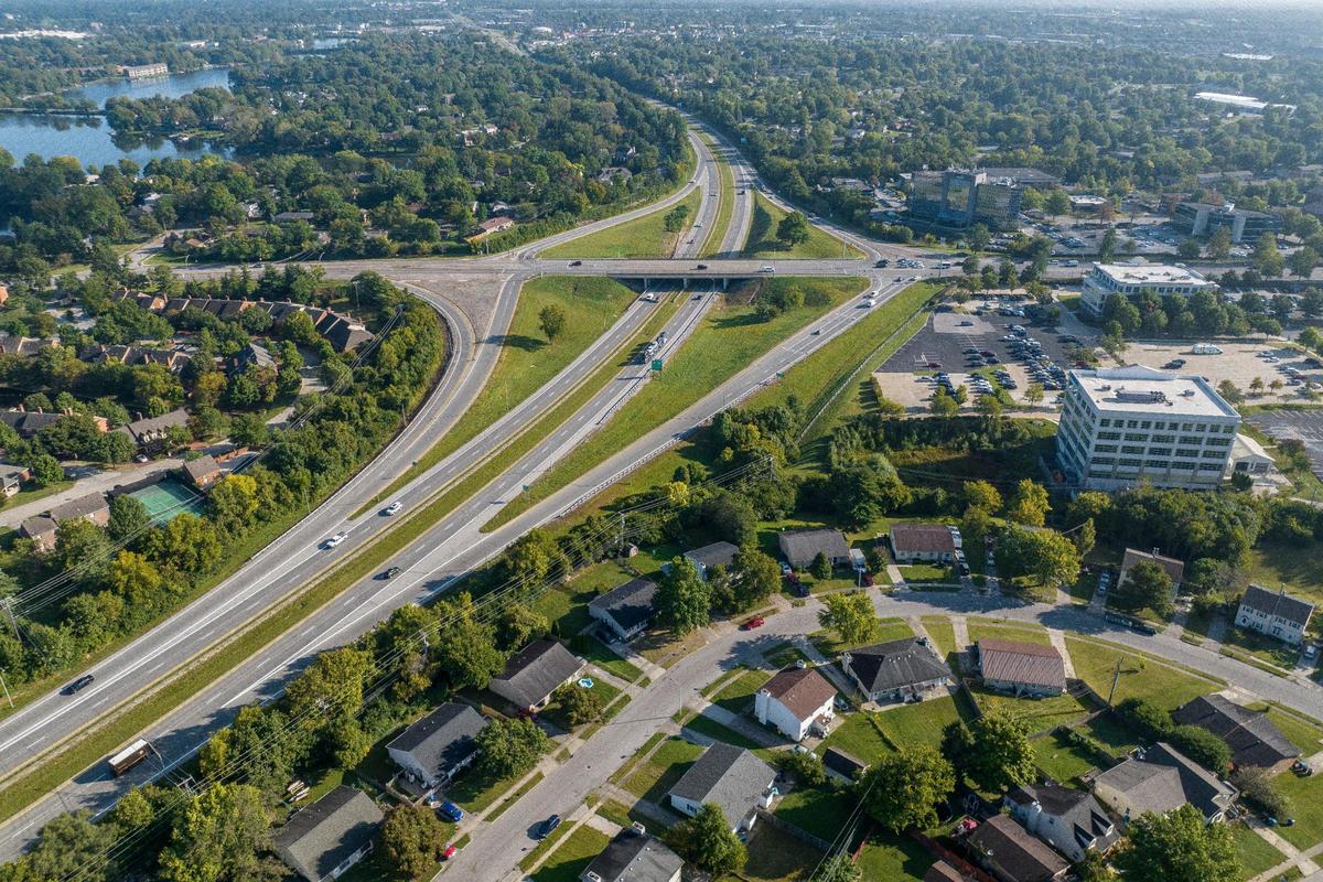 Later renamed Alumni Drive, the current interchange has the UK Healthcare Administration Offices, the tallest white building at right, and several other buildings in an office park while some residential structures were built and are shown in the lower part of the photo.