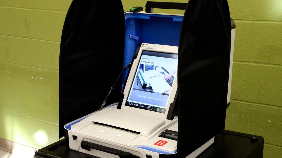 A new type of voting machine, first used in Kentucky’s 2022 Primary Election, Tuesday, May 17, 2022 at the Fairway precinct in Lexington, Ky. The machines, called the InterCivic are made by the Hart company. It uses a paper ballot, first filled out by the voter, and then scanned into this machine, which is nearby the voting booth.