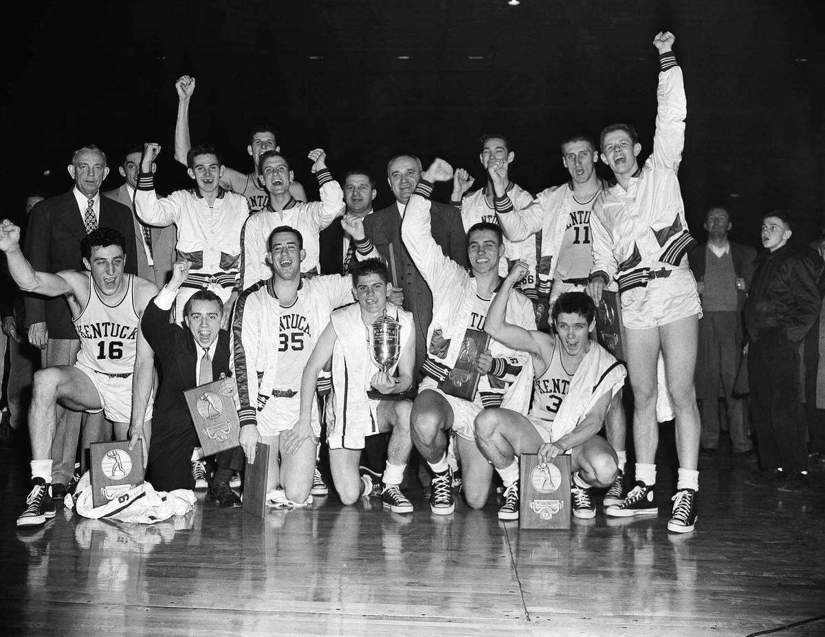 The 1950-51 Kentucky Wildcats celebrated after winning the 1951 NCAA championship in Minneapolis. Team members were, front row, left to right: Lou Tsioropoulos, C.M. Newton, Bobby Watson, Cliff Hagan, Lucian Whitaker and Frank Ramsey. Players in the rear were, left to right: Dwight Price, Bill Spivey, Guy Strong, Roger Layne and Shelby Linville.