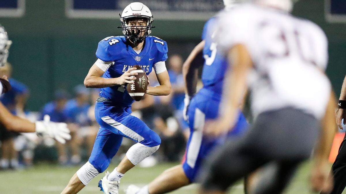 Lexington Catholic’s Jack Gohmann (14) runs the ball during a game earlier this season. The Knights advanced Friday with a first-round playoff win over Bourbon County.