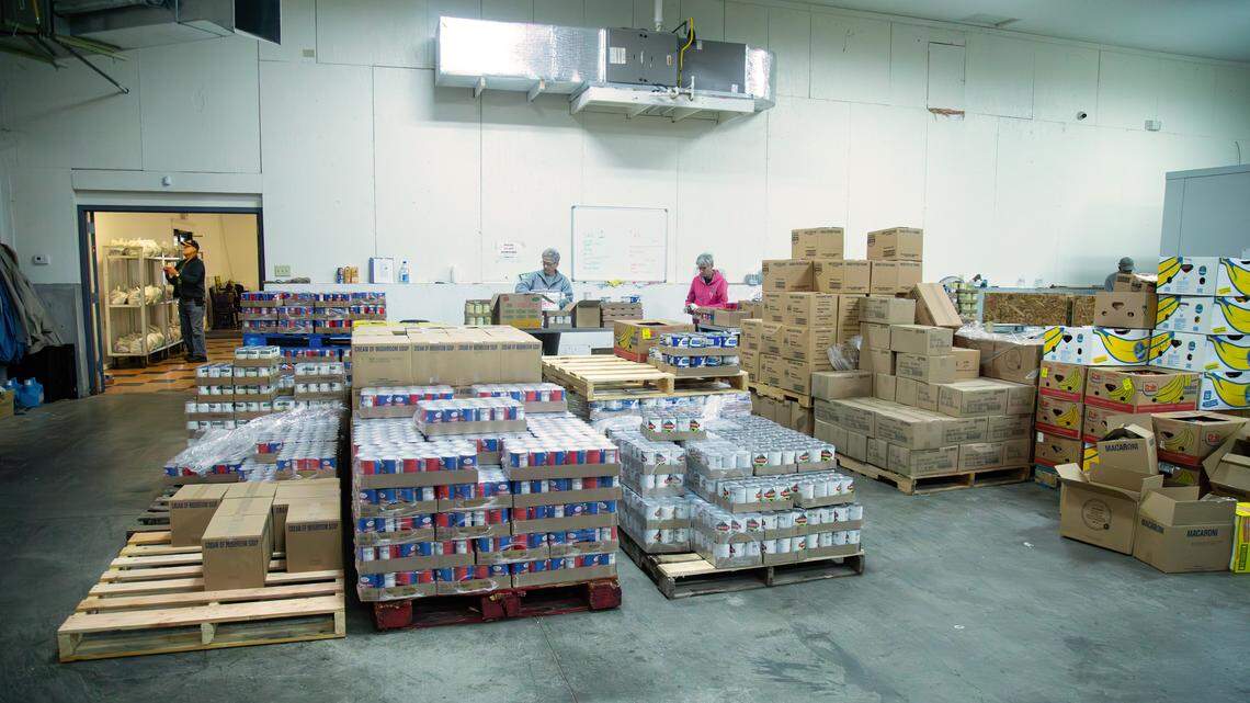 God's Outreach Food Pantry volunteers sorting through non-perishables to be packaged and delivered to food recipients during the drive-through donations on Nov. 3, 2025, in Richmond, Ky