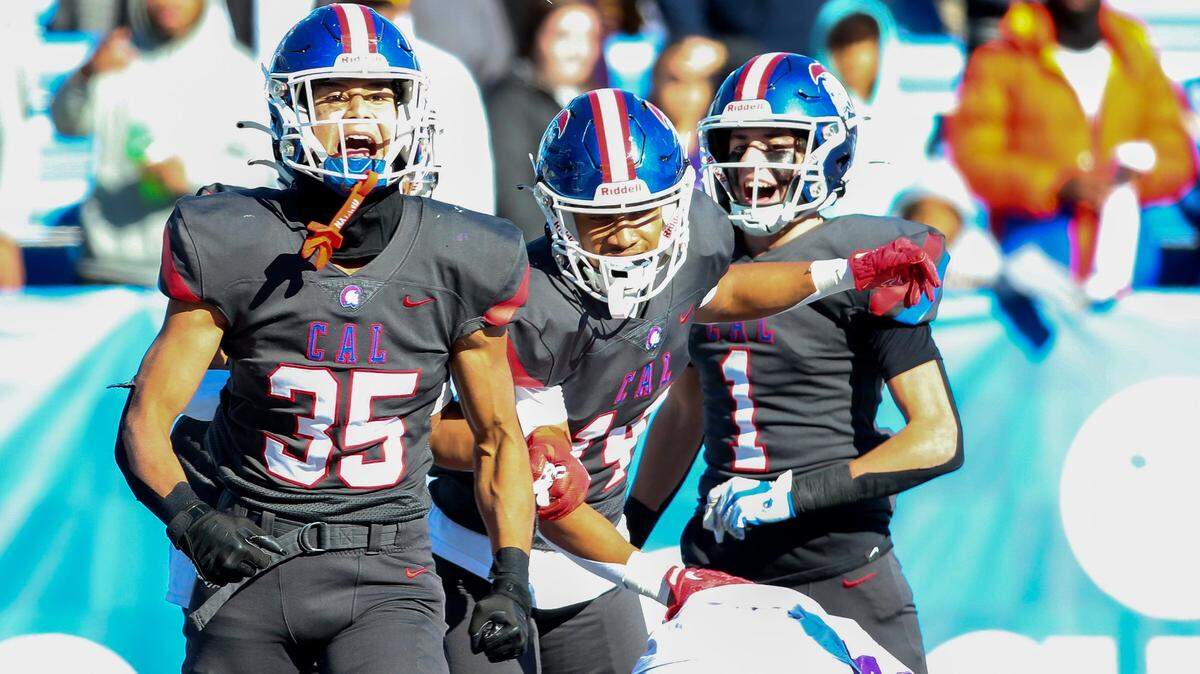 Christian Academy-Louisville’s Trey Cotton (35) celebrates with teammates after scoring a first-half touchdown on a 23-yard pass from Cole Hodge against Bardstown on Saturday.