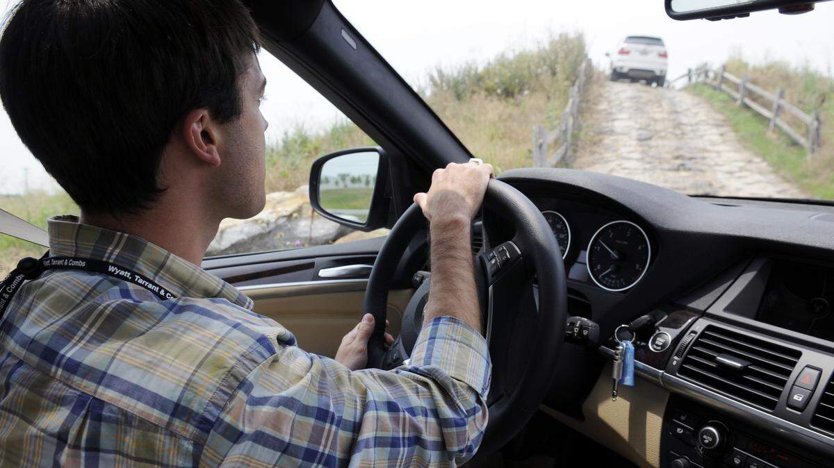 Grant Mills of Fortune Hi-Tech Marketing tested a BMW X5 SUV at the BMW Performance Driving School near Greenville, S.C., during the first day of Commerce Lexington's three-day trip to the city.  