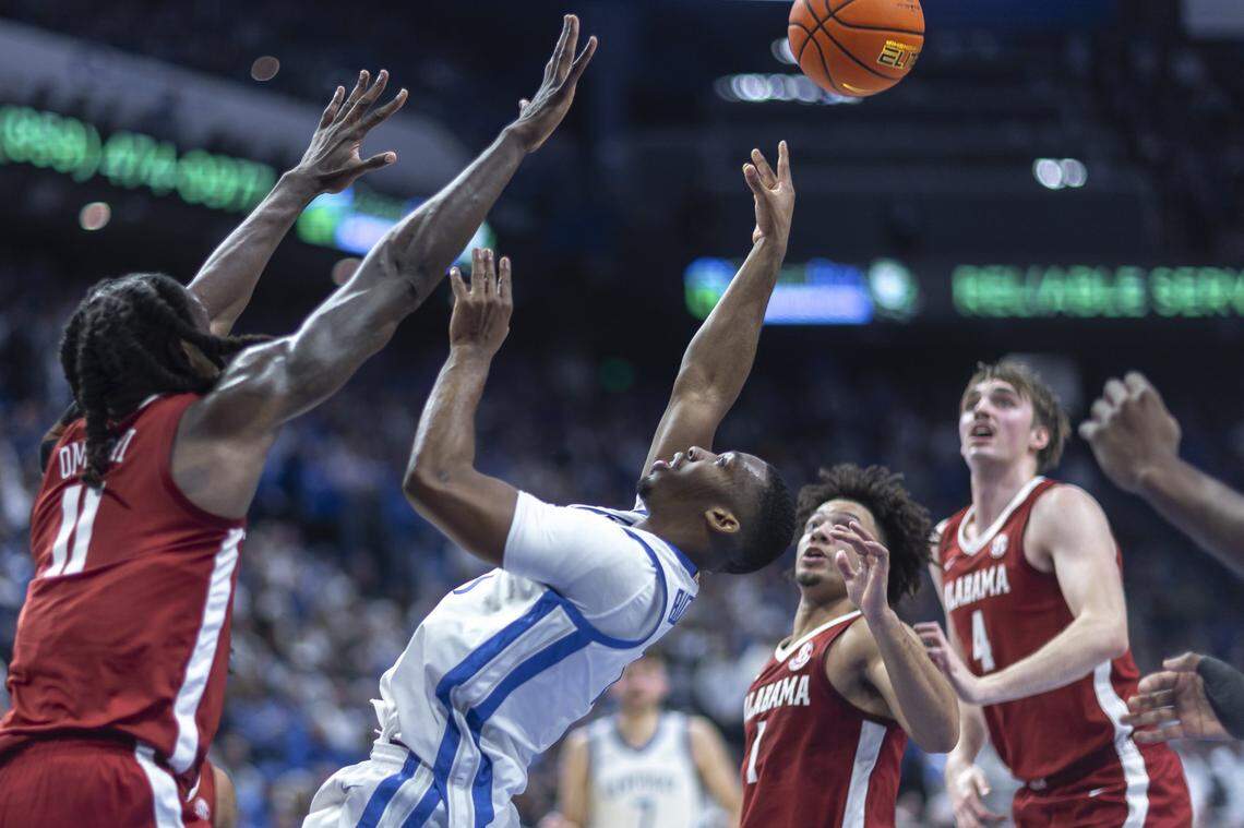 Kentucky Wildcats guard Lamont Butler (1) shoots the ball over Alabama Crimson Tide center Clifford Omoruyi (11) during a game at Rupp Arena in Lexington, Ky., on Saturday, Jan. 18, 2025.