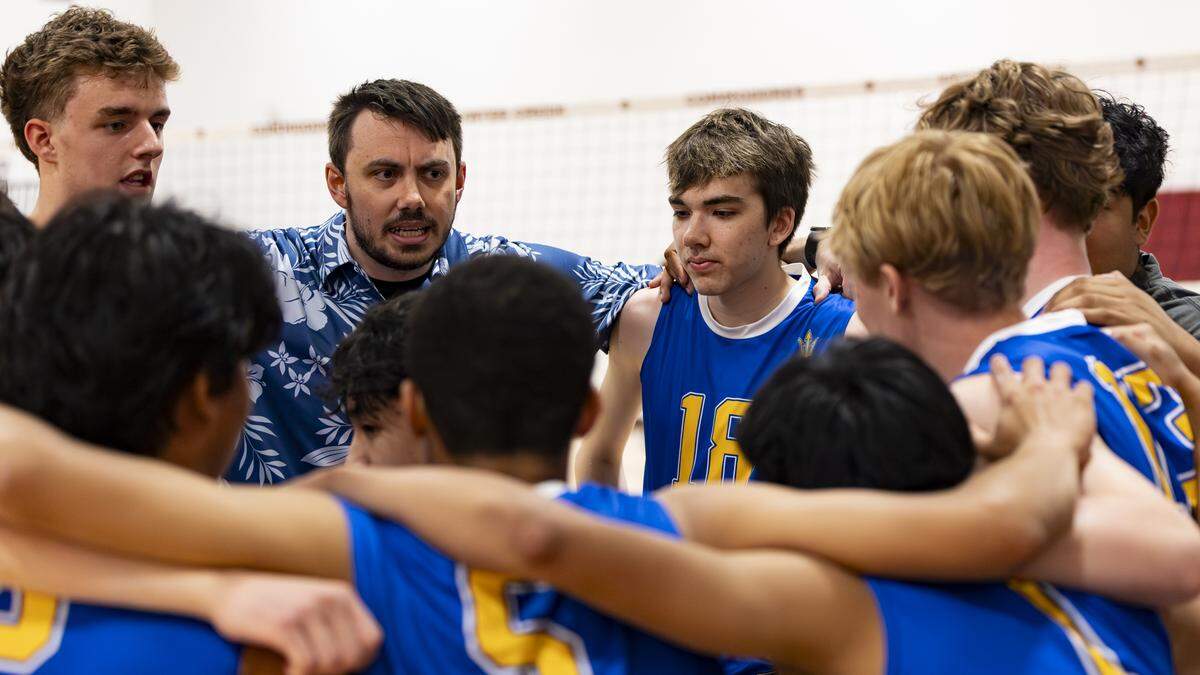 Henry Clay coach Luke Grupe, center-left, talks with his players during a timeout in the Blue Devils 3-0 win at Tates Creek High School on Wednesday.
