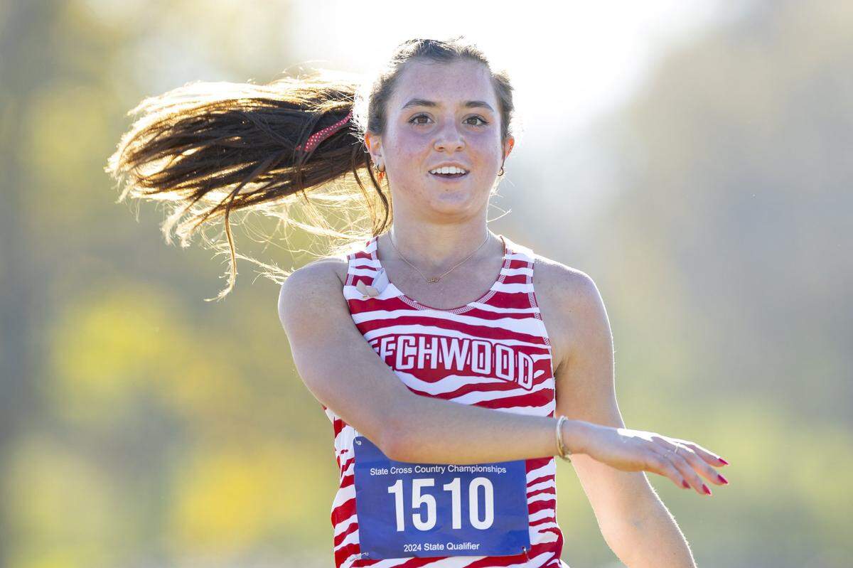 Beechwood’s Lily Parke reacts after finishing first in the Class A girls state cross country meet at the Kentucky Horse Park on Saturday.