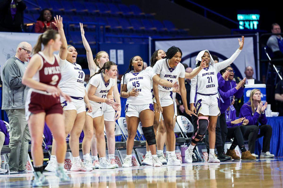 The Bowling Green bench erupts in celebration as the Purples overcame a 15-point deficit to defeat Owsley County in the opening game of the Girls’ Sweet 16 on Wednesday.