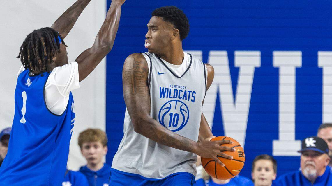 Kentucky forward Brandon Garrison (10) looks for an outlet pass under defensive pressure from Kentucky guard Denzel Aberdeen (1) during the annual Blue-White Game last Friday at Memorial Coliseum. 