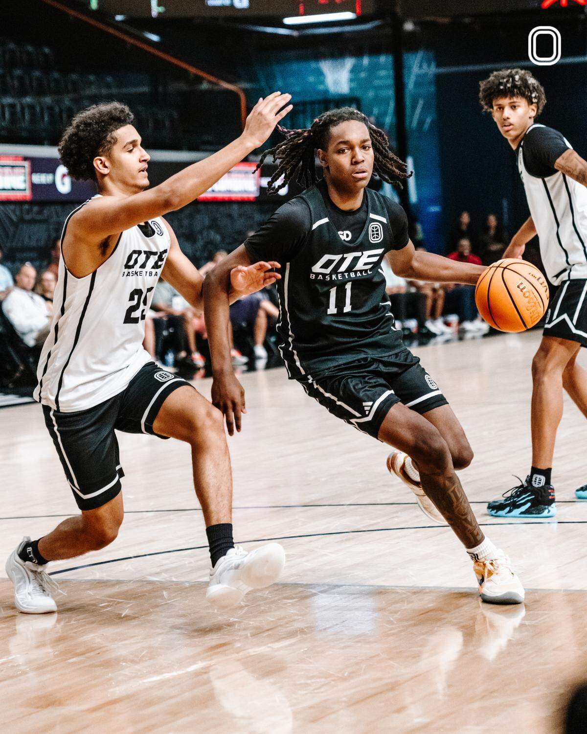Class of 2025 Kentucky men’s basketball commit Jasper Johnson dribbles through defenders during the Overtime Elite fall combine at the OTE Arena in Atlanta on Sept. 24.