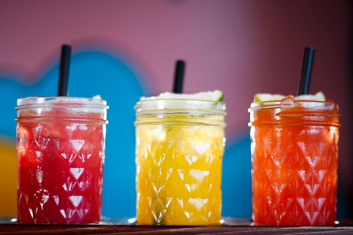 The house margarita flight served with pomegranate, from left, mango and strawberry margaritas at Condado Tacos at The Summit at Fritz Farm.