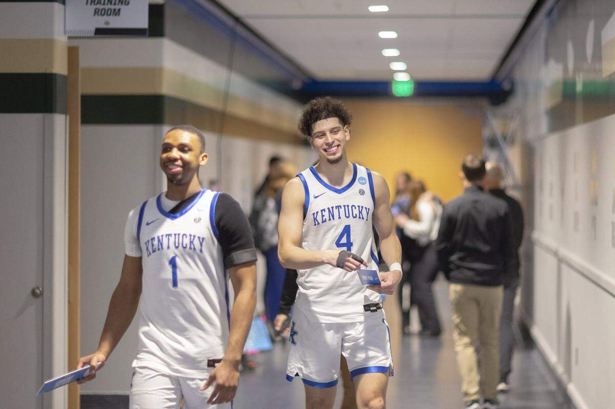 Kentucky guards Lamont Butler (1) and Koby Brea (4) return to the UK locker room after being interviewed following a second-round NCAA Tournament victory against Illinois at Fiserv Forum in Milwaukee on Sunday.