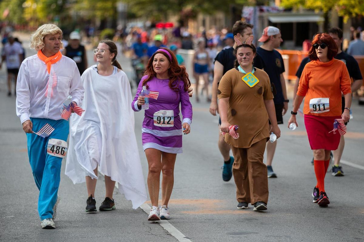 A group dressed up as the Scooby Doo gang crossed the finish line together during the 2021 Bluegrass 10,000.