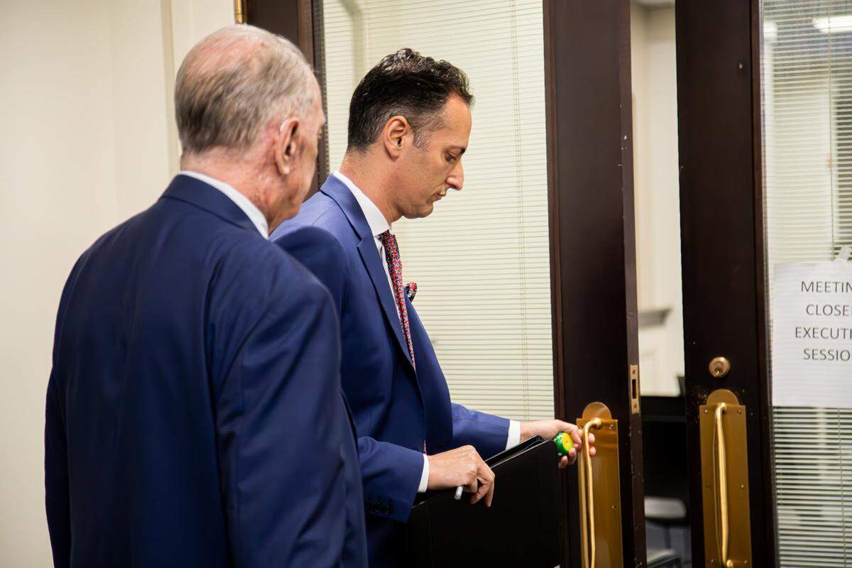 Rep. Daniel Grossberg, D- Louisville, shown with legal counsel entering a closed session of the Legislative Ethics Commission, with testimony from complainants of his alleged misconduct at the Kentucky Capitol annex in Frankfort on June 17, 2025.