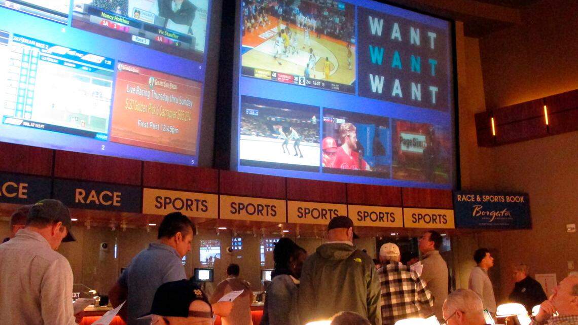 Gamblers line up to place bets on the NCAA men’s college basketball tournament at the Borgata casino in Atlantic City N.J., in 2019. When the NFL season kicks off, Kentucky residents will be able to legally bet on games for the first time.
