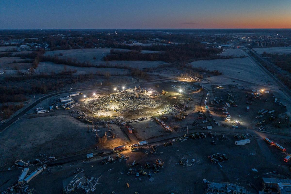 Search are rescue crews work at the Mayfield Consumer Products candle factory early Sunday, Dec. 12, 2021. A tornado traveled through the region Friday night.