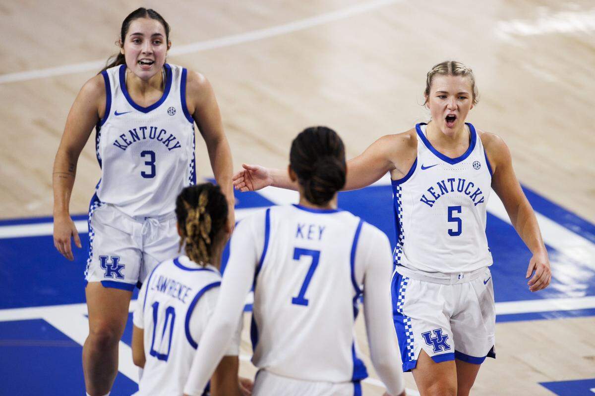 Georgia Amoore (3), Dazia Lawrence (10), Teonni Key (7) and Cassidy Rowe (5) revel in Kentucky’s easy bounce-back win over Queens in Memorial Coliseum on Monday night.