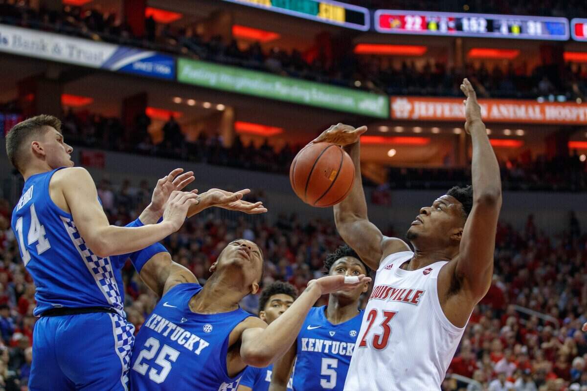 Louisville center Steven Enoch (23) battled for a rebound last season in the Cardinals’ 71-58, home loss to Kentucky. Enoch finished with five points, nine rebounds and a blocked shot vs. UK last year.