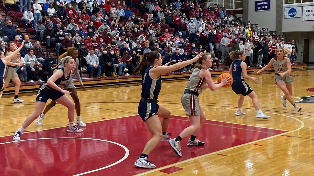Transylvania’s Madison Kellione holds the ball during the Pioneers’ Elite Eight NCAA Division III Tournament game against Trine University on Saturday night in Lexington. Kellione led Transy with 15 points, but the Pioneers lost their first game of the season.