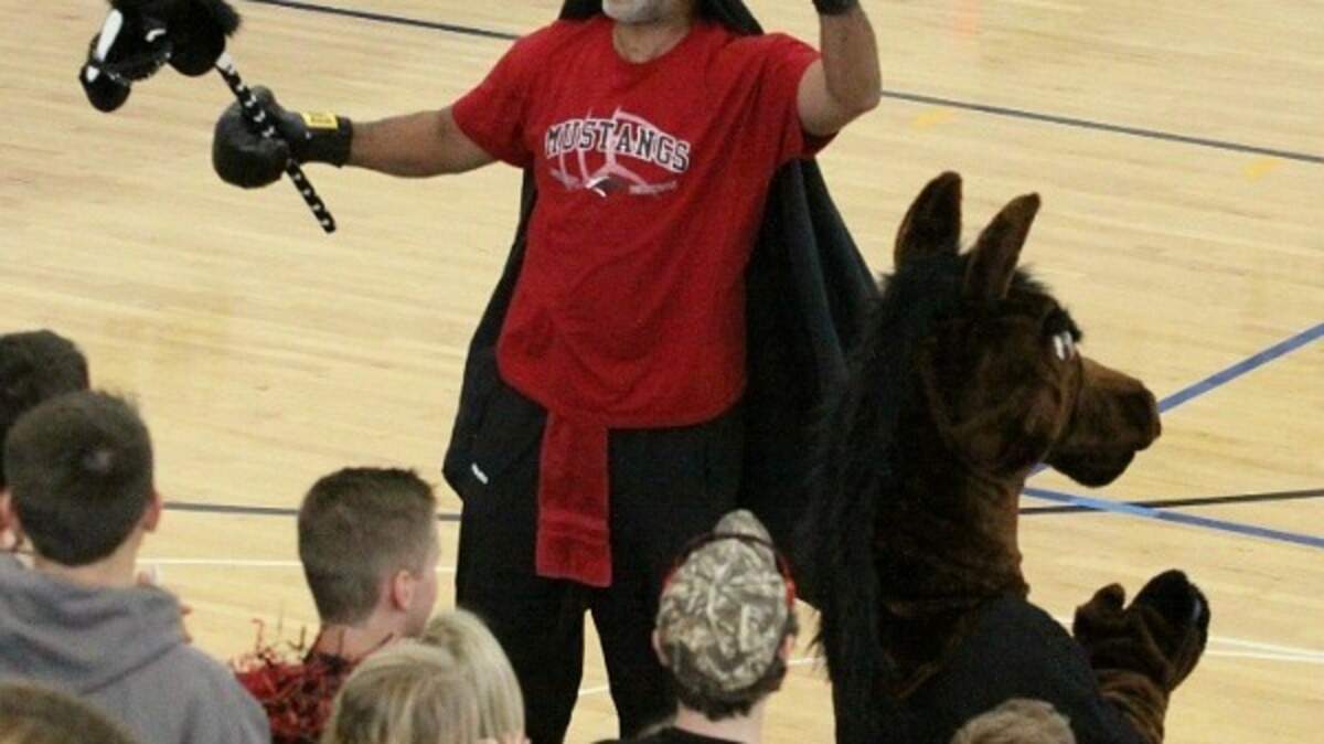 Former University of Kentucky basketball star WInston Bennett cheered on the McCracken County Mustangs volleyball team during the state tournament last week. Bennett's daughter Jasmine played for the Mustangs and has signed to play collegiately at Louisville. (McCracken County photo)