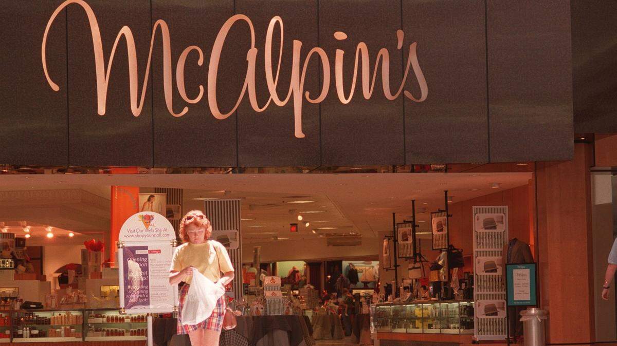 In this file photo, a shopper leaves the Fayette Mall McAlpin’s department store in Lexington on May 18, 1998. The store closed in 1998 after it was bought out by Dillard’s. On Sunday, former employees of the department store gathered at The Cellar on Lansdowne Drive for a reunion.