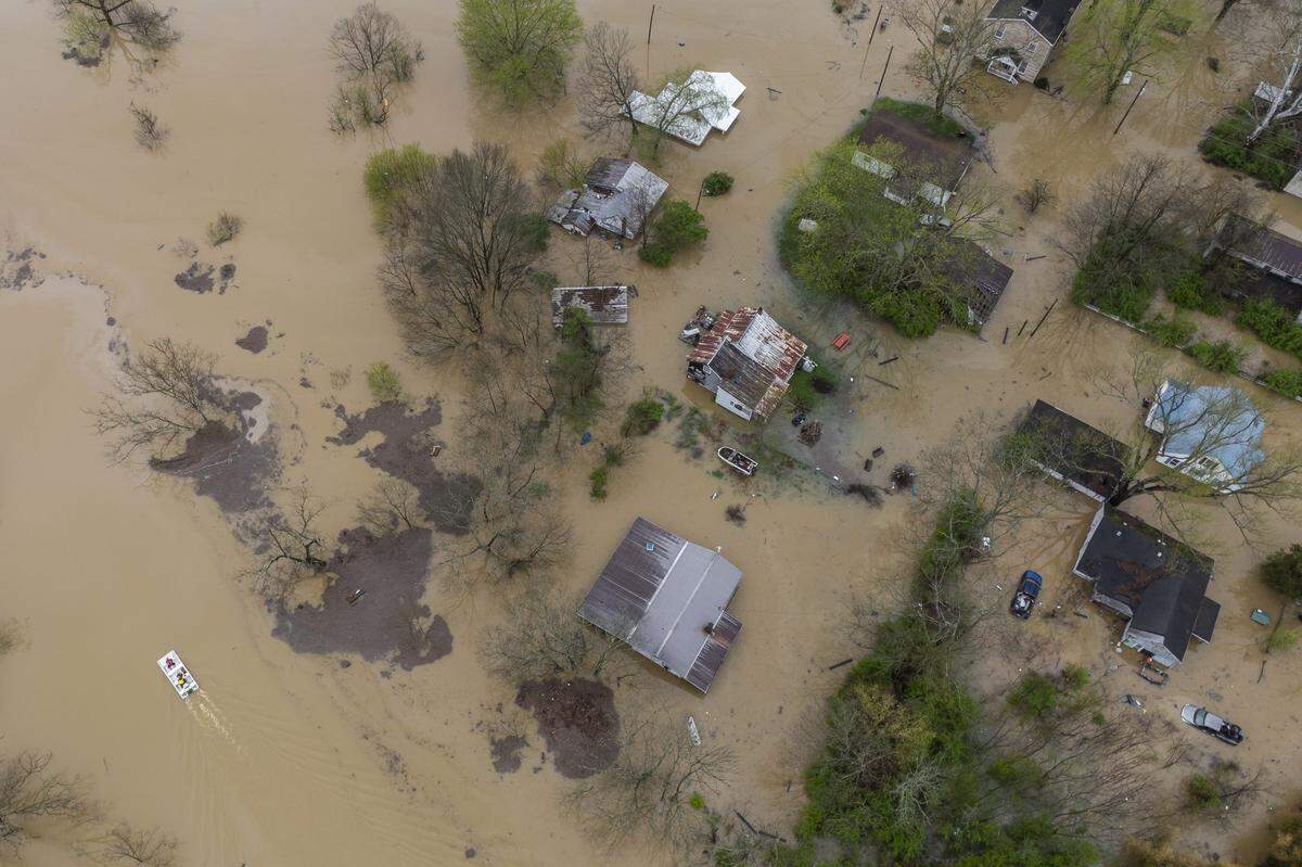 An Owen County Search and Rescue vessel passes by the flooded community of Monterey, Ky., on Sunday, April 6, 2025.