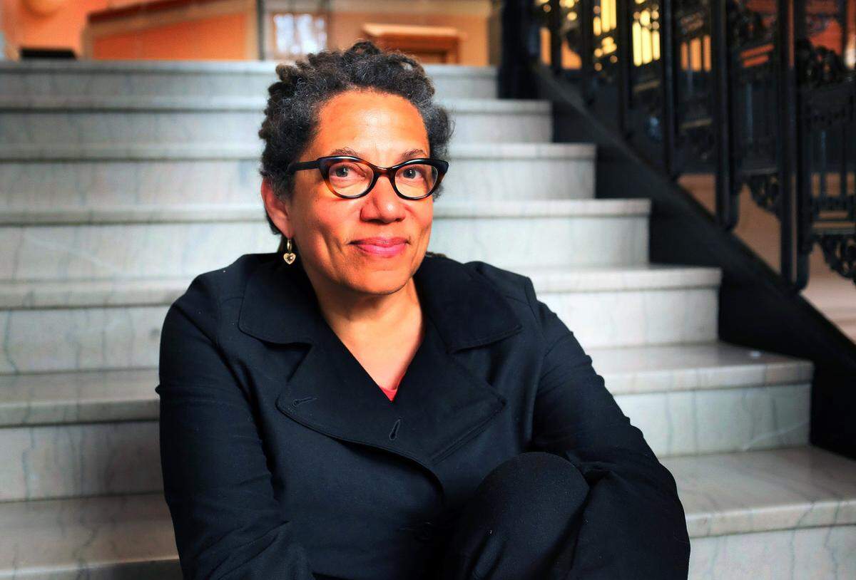 Poet Nikky Finney poses on the marble steps of the Carnegie Center  for Literacy and Learning in 2013. She returns this weekend for events marking the opening of “I Was Here,” a multidisciplinary exhibit illuminating the horrors of the slave trade at the Cheapside auction block in downtown Lexington.