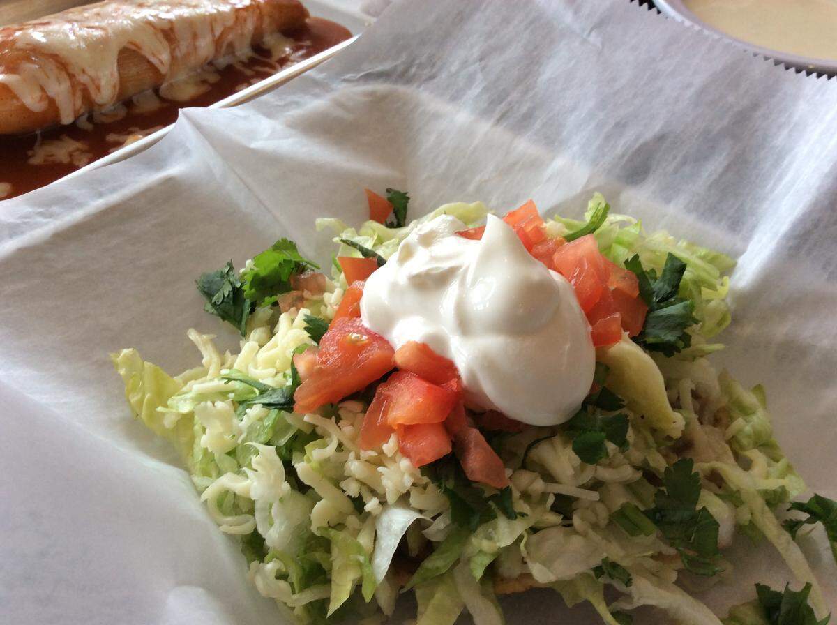 A bean sopes and a pork tamales at El Cid, which is open for lunch and dinner at 304 South Limestone.