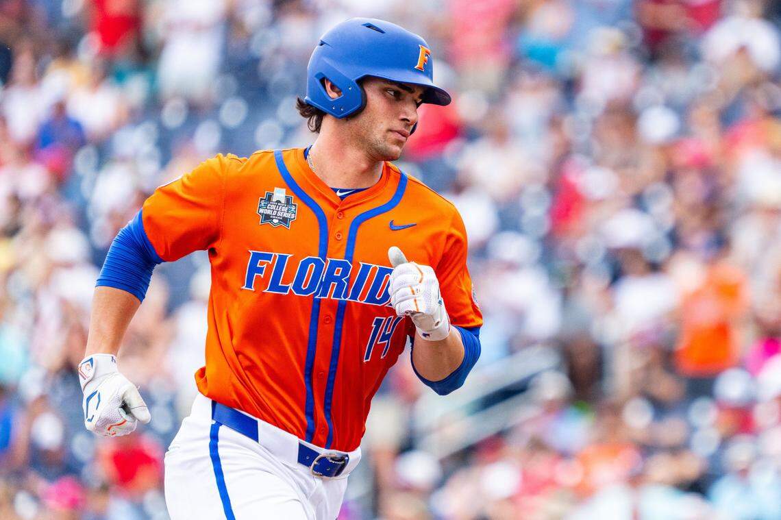 Jun 17, 2024; Omaha, NE, USA; Florida Gators starting pitcher Jac Caglianone (14) runs the bases after hitting a three-run home run against the NC State Wolfpack during the second inning at Charles Schwab Field Omaha. Mandatory Credit: Dylan Widger-USA TODAY Sports