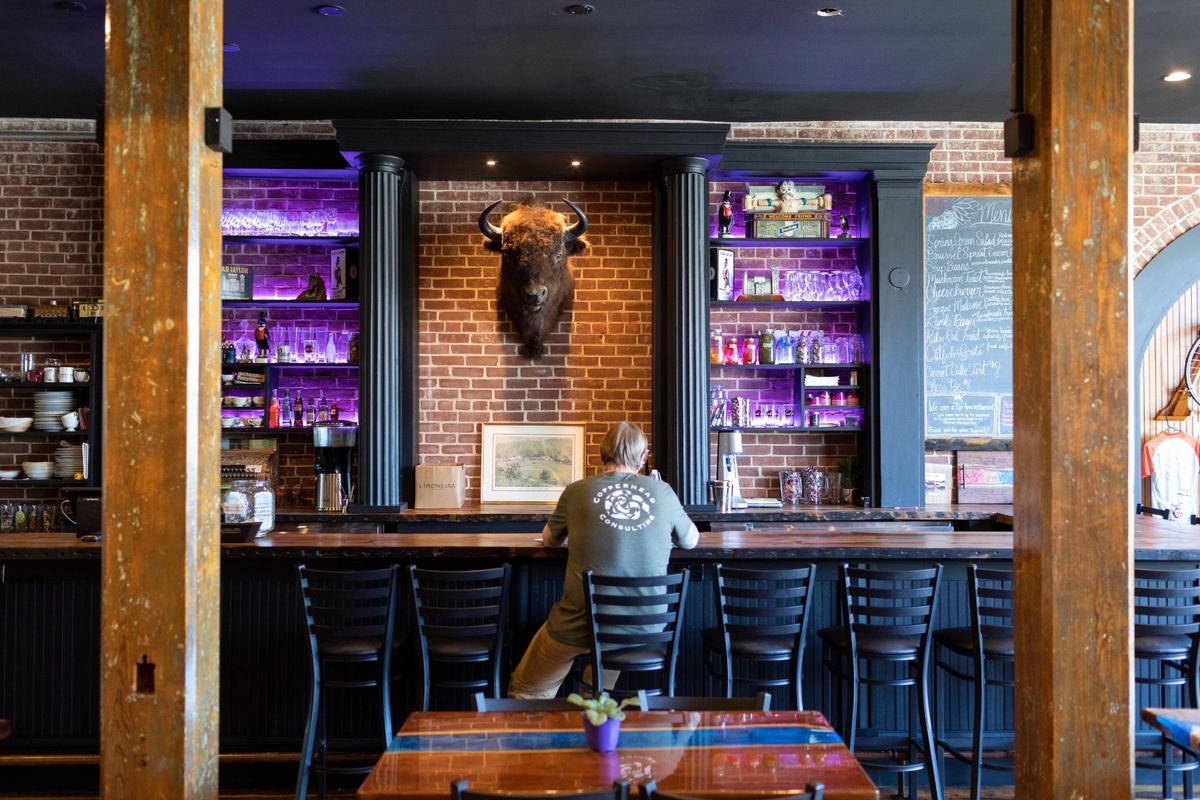 Patrons sit at the bar in Solidago restaurant in Paint Lick, Ky., Wednesday, April 12, 2023.