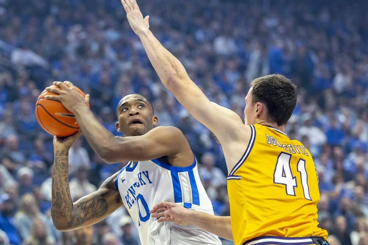 Kentucky forward Brandon Garrison (10) looks to shoot the ball over Lipscomb forward Jacob Ognacevic (41) during a game at Rupp Arena on Nov. 19, 2024. Prior to coming to Kentucky, Garrison played one season at Oklahoma State.