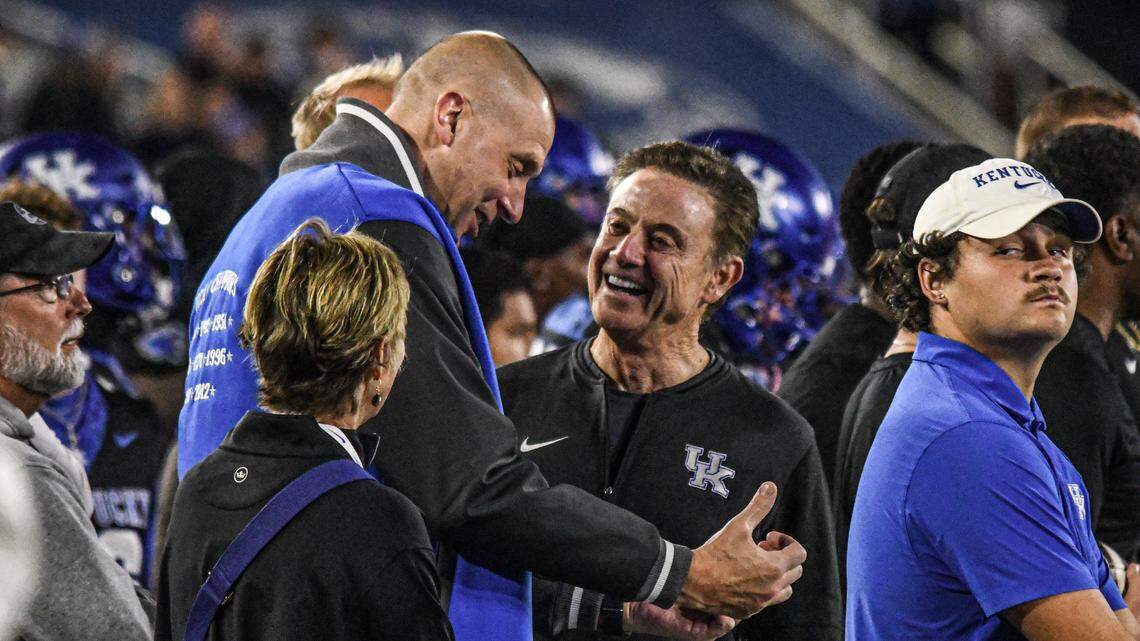 Kentucky coach, Mark Pope, shared a laugh on the sideline t UK’s 2024 football game with Vanderbilt with his former coach  at UK , Rick Pitino. On Saturday, Pope will coach the Wildcats against Pitino and St. John’s. 