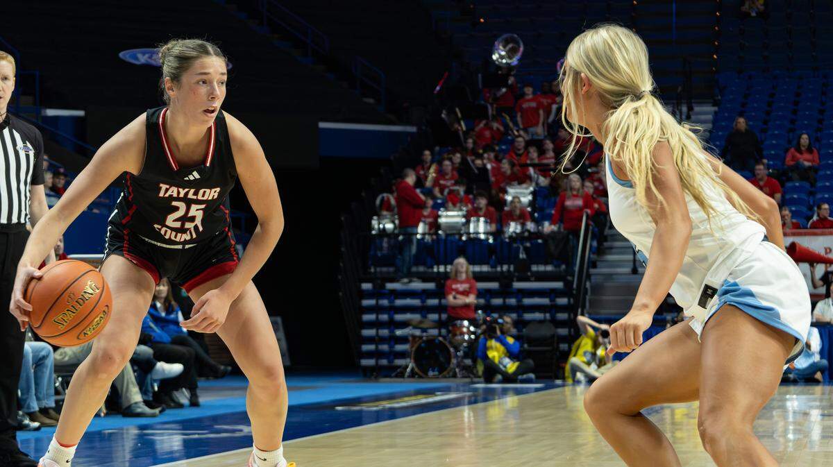 Taylor County's Kennedy Deener looks for an open pass or a way around West Jessamine's Isabella Lewis during the 2026 Clark's Pump-N-Shop Girls' Basketball Sweet 16 state tournament first-round game between West Jessamine and Taylor County at Rupp Arena on March 11, 2026, in Lexington, Ky.