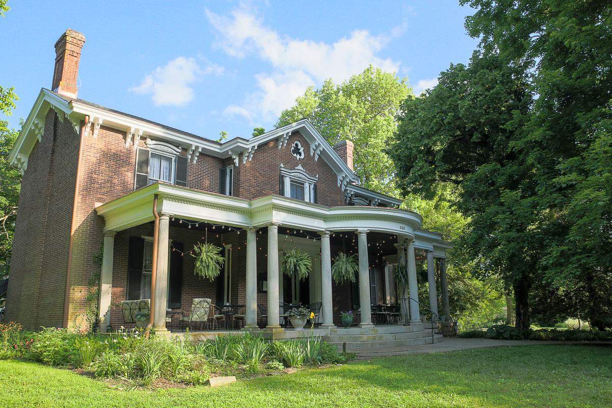 Holly Hill Inn, the Midway flagship restaurant for chef Ouita Michel, puts its huge front porch to go use.