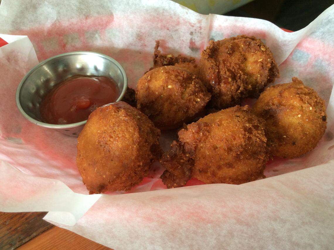 The Belt Line, 808 N. Limestone, offers Gullah hushpuppies as a side and an appetizer as part of Hushpuppy Poutine, made with andouille sausage and chicken gumbo gravy.