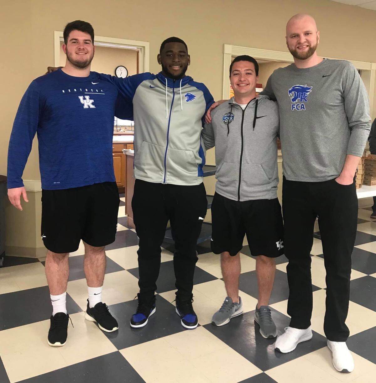 Central Kentucky Fellowship of Christian Athletes Area Director Dakotah Euton, right, with Kentucky Wildcats football players Eli Cox (left), Josh Paschal (center) and Matt Ruffolo.