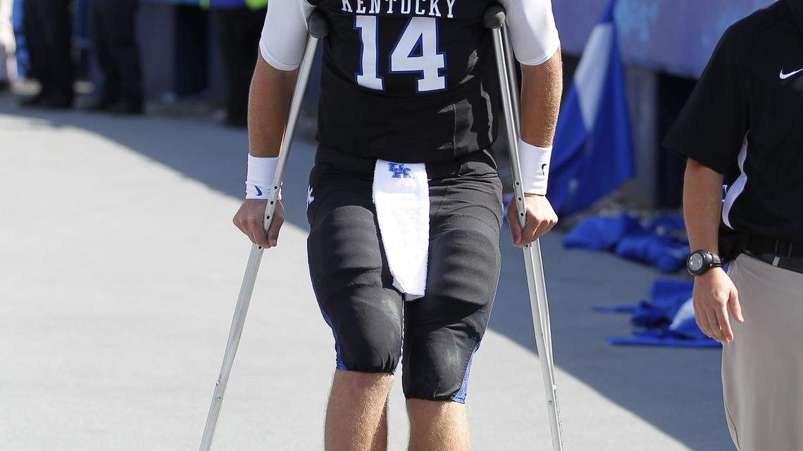Kentucky Wildcats quarterback Patrick Towles (14) was on crutches after the half as  Mississippi State defeated Kentucky 27-14   on Saturday October 6, 2012 in Lexington, Ky. Photo by Mark Cornelison | Staff
