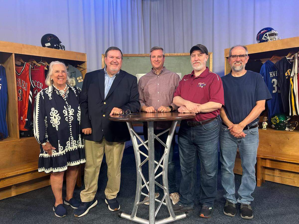 The “Scholastic Ball Report," a Kentucky high school sports interview and highlights show for 23 years, signs off Sunday. “SBR” team members, from left, Brigid DeVries, executive producer; Gary Ball, host; Joel Claes, director; Brack Benningfield, first director; and John Neal, floor director; pose for a photo at the show’s final taping on Sept. 17.