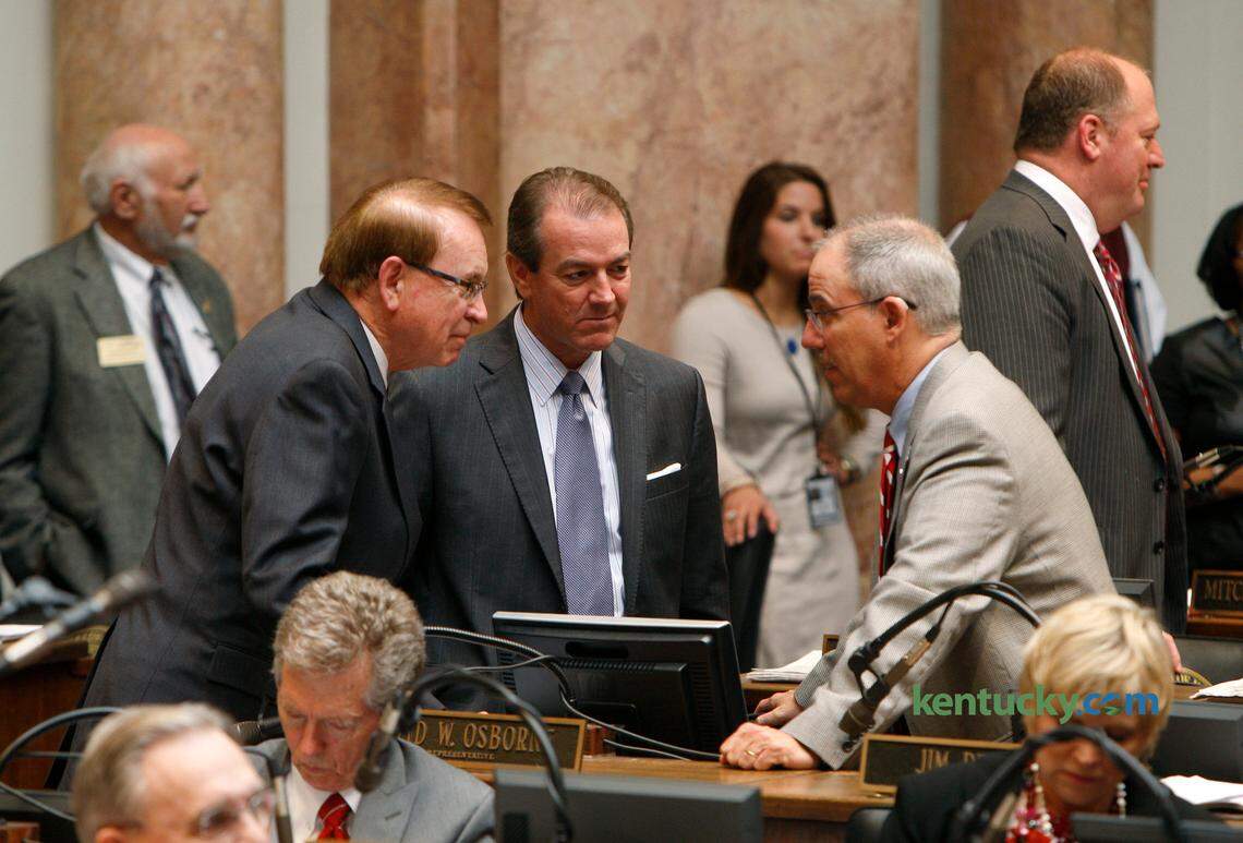 Rep. Jody Richards, D-Bowling Green, left, Rep. David Osborne, R-Prospect, and Rep. Jim DeCesare, R-Rockfield, chat on the House floor on the last day of Kentucky's 2014 General Assembly at the Capitol in Frankfort, Ky., Tuesday, April 15, 2014. Photo by Matt Goins