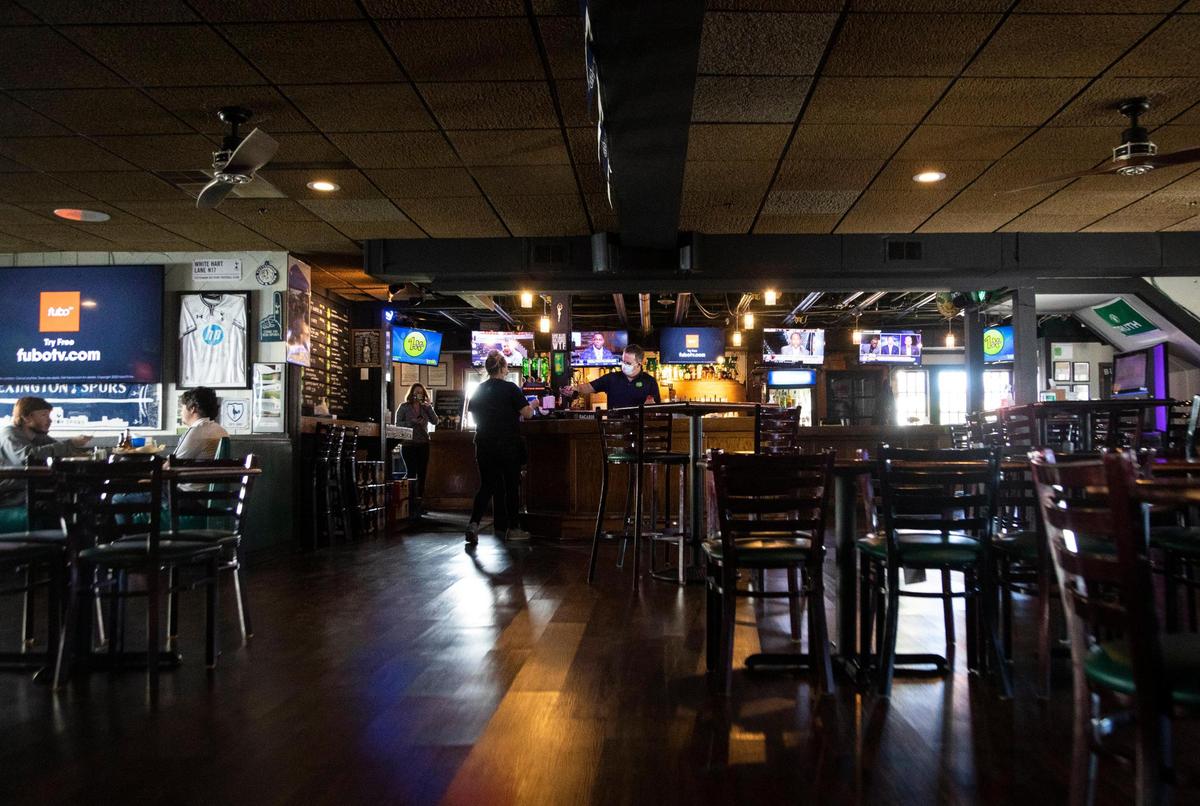 Patrons have a meal at the Shamrock Bar & Grille in Lexington, Ky., Wednesday, November 18, 2020.
