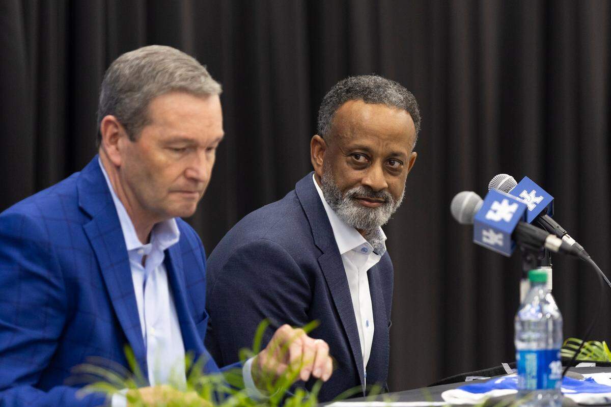 Kenny Brooks, right, coached 14 seasons at James Madison and eight at Virginia Tech before being hired at Kentucky.