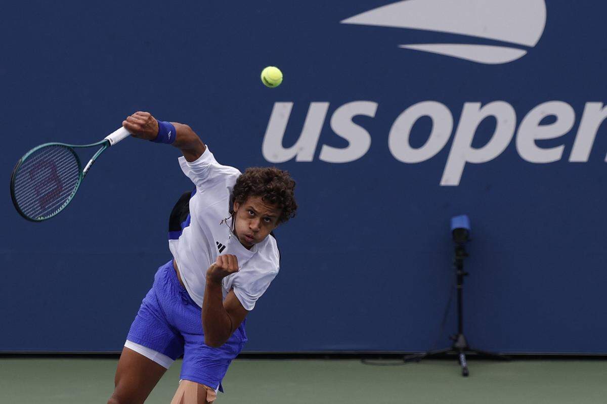Aug 29, 2024; Flushing, NY, USA; Gabriel Diallo (CAN) serves against Arthur Fils (FRA)(not pictured) in a men's singles match on day four of the 2024 U.S. Open tennis tournament at Billie Jean King National Tennis Center. Mandatory Credit: Geoff Burke-USA TODAY Sports