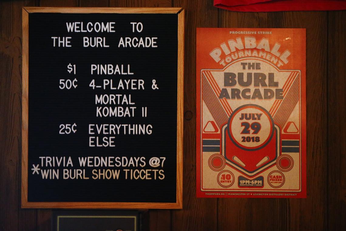 Signs informed patrons of prices and events Thursday at the Burl Arcade in Lexington.  The Burl Arcade offers a variety of retro games including Pac-Man, Galaga, skee ball and pinball.