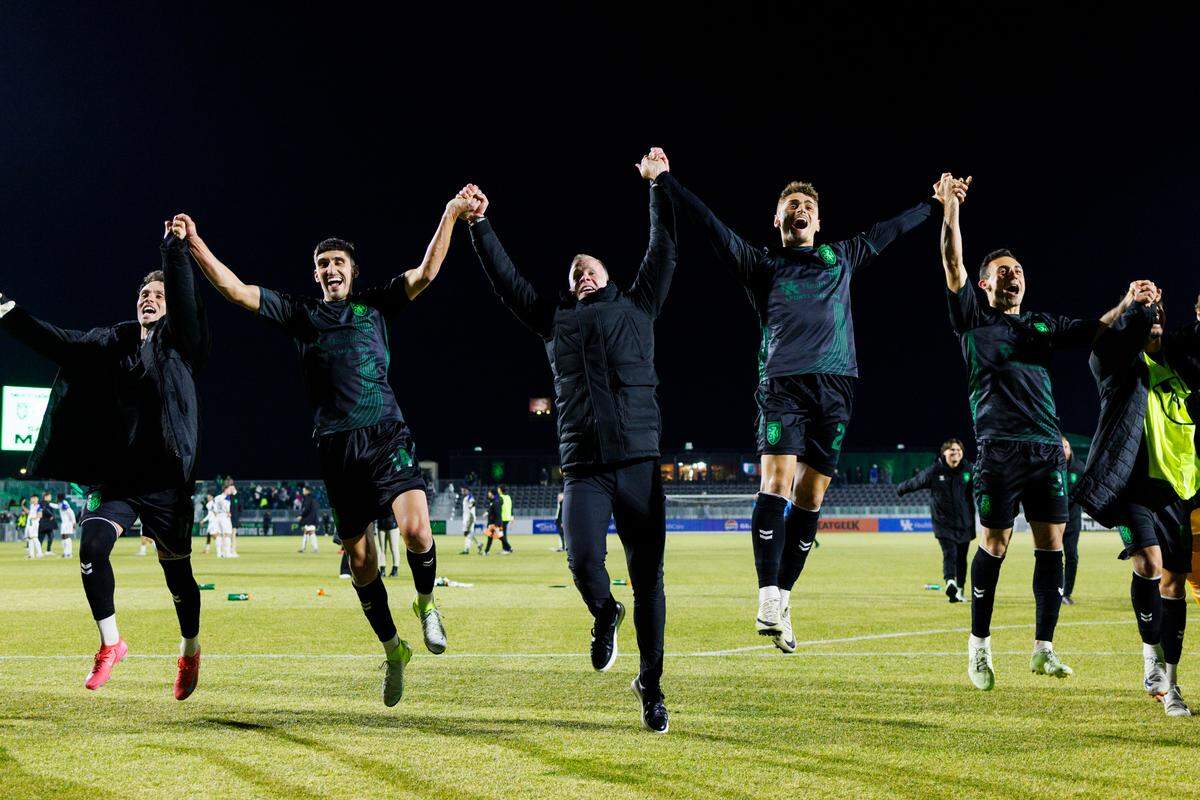 Lexington Sporting Club coaches and players celebrate a win over Hartford Athletic to begin the USL Championship season on Saturday at Lexington SC Stadium.