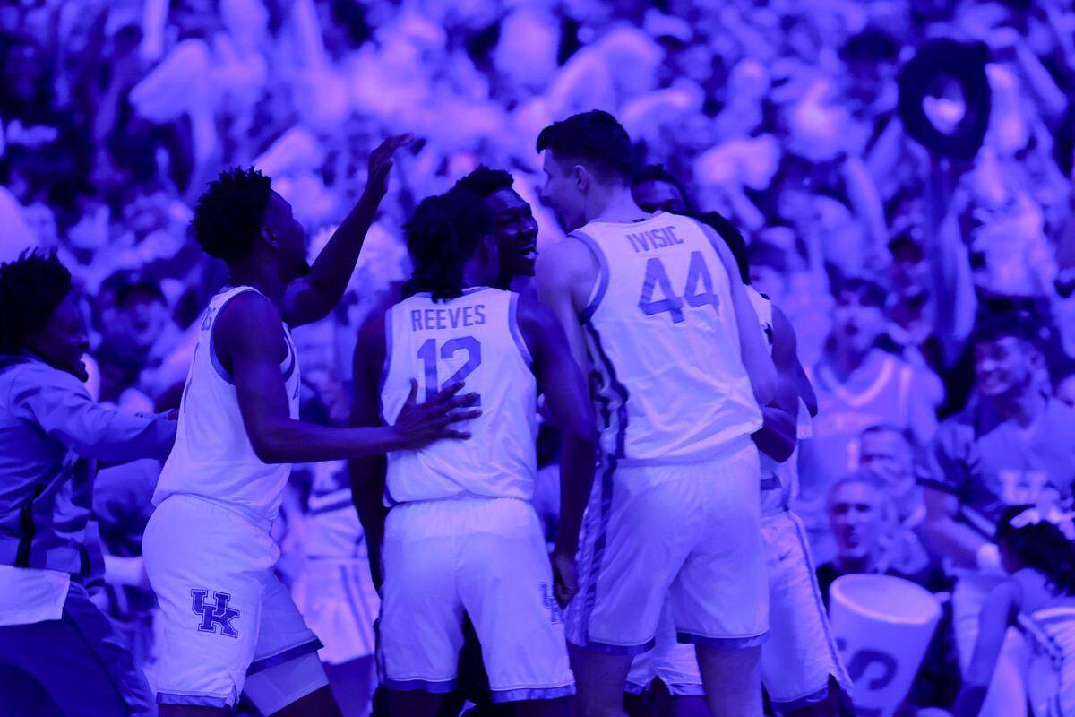 Kentucky forward Zvonimir Ivisic (44) and his teammates celebrate a behind-the-back pass for an assist against Georgia.