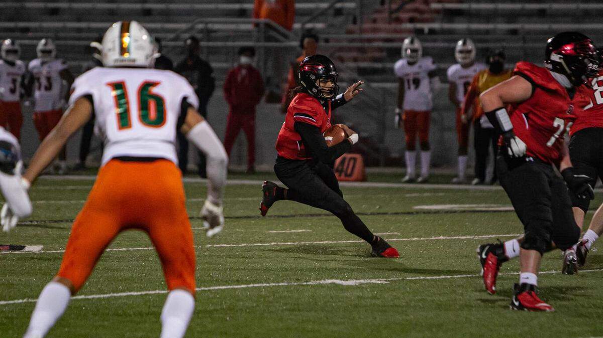 Owensboro quarterback Gavin Wimsatt looked for running room during a play against Frederick Douglass in the Class 5A state semifinals in Owensboro on Dec. 11, 2020. Owenboro won 28-27.