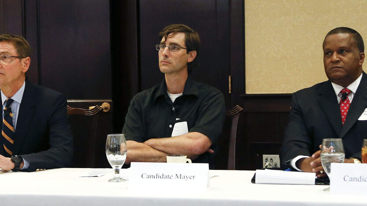 From left, Lexington Mayor Jim Gray, Danny Mayer and Anthany Beatty listened to a question from the audience Thursday morning as The Lexington Forum hosted the first mayoral debate of the primary season. Gray is running for re-election against Mayer and Beatty.