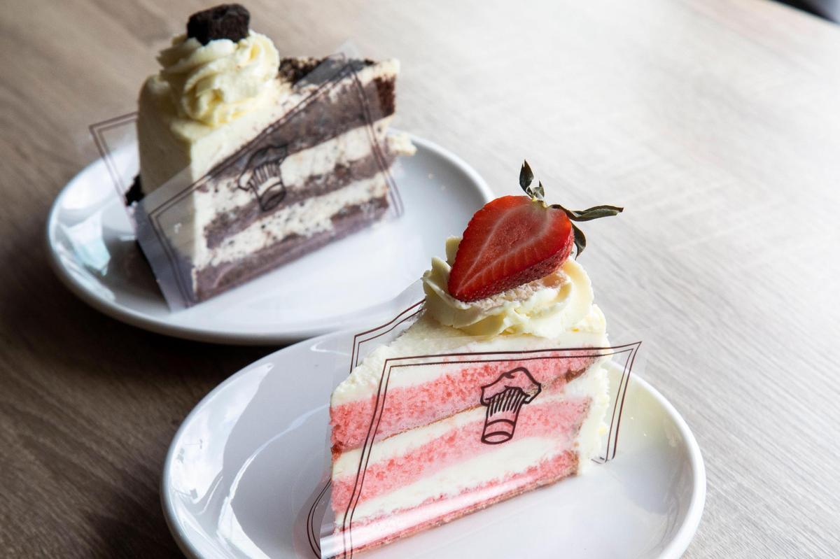 Slices of strawberry white chocolate (right) and chocolate cake from European Delights Bakery in Nicolasville.