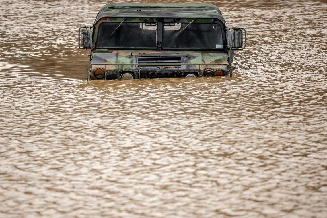 A vehicle was surrounded by floodwater in the parking of the Johnson County Judicial Center in Paintsville Monday.